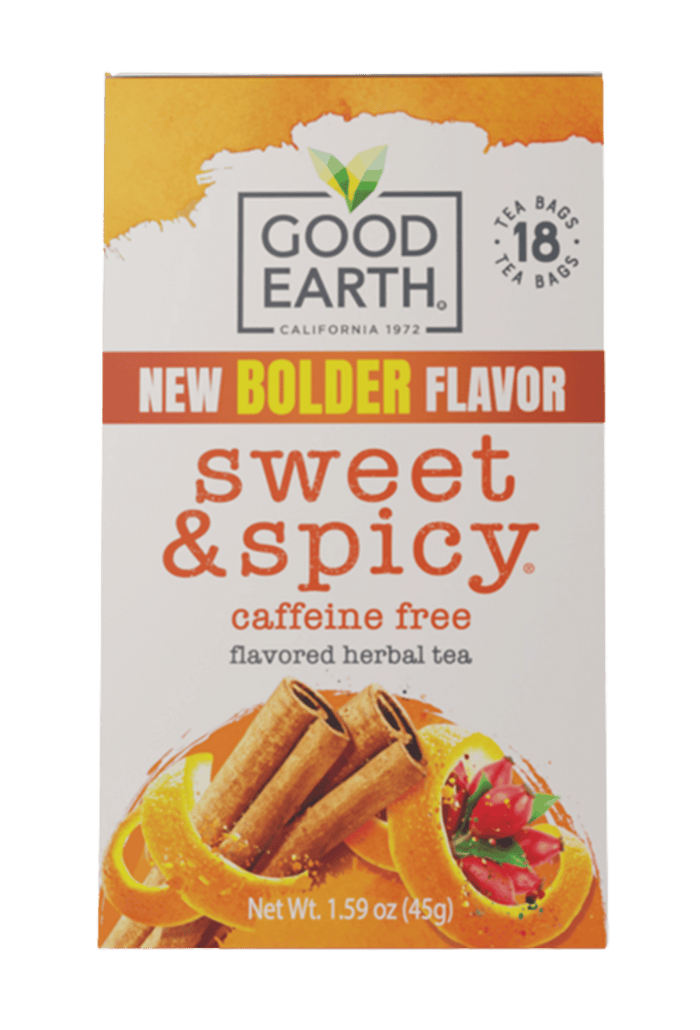 A box of Good Earth Sweet & Spicy Caffeine Free Flavored Herbal Tea. The packaging features a white background with orange and red accents, showing illustrations of cinnamon sticks, orange slices, and strawberries.
